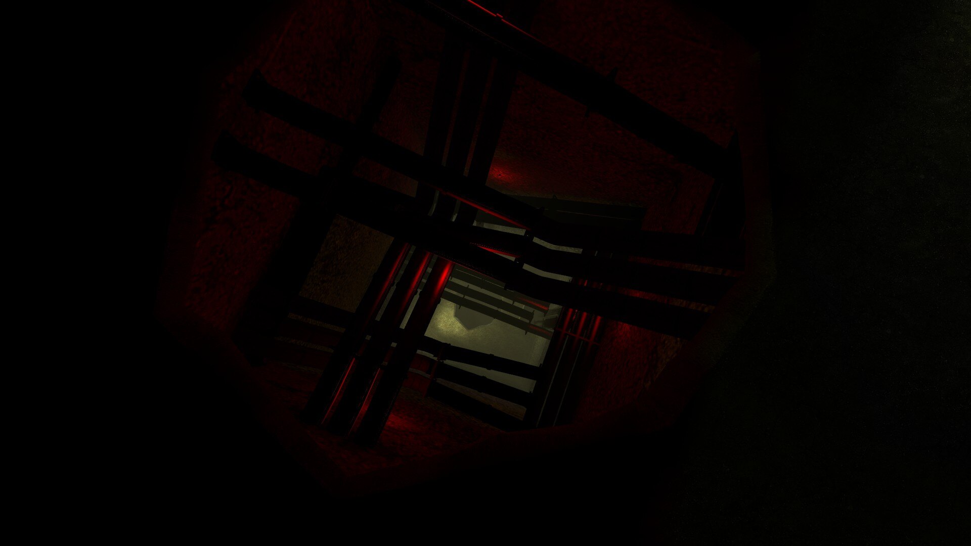 A dark red maintenance shaft beneath the complex